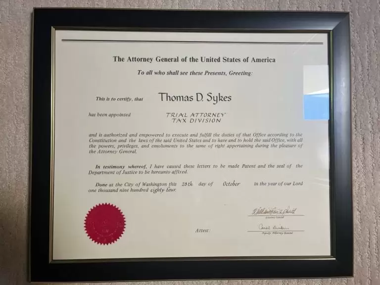 Certificate appointing Thomas D. Sykes as Trial Attorney, Tax Division, signed by the Attorney General of the United States